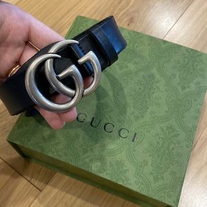 Gucci Belt; black leather with silver Gs. Original dust bag and box included